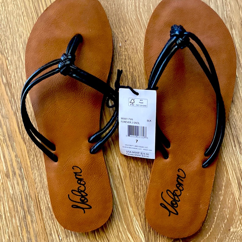 Volcom size 7 black and tan slippers / sandals. Never worn